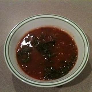 This soup starts with a chicken stock, is made savory with dried herbs, garlic, leeks, and mushrooms, and then finished with a few shredded spinach leaves and grated parmesan.  Most of the vegetables are strained out, so it is not really filling enough to