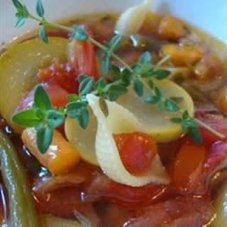 This is a traditional minestrone complete with leeks and zucchini in a tomato soup base with cannellini beans and pasta.  Serve with grated Parmesan cheese.