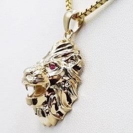pendentif tete de lion en or 18 carats et rubis